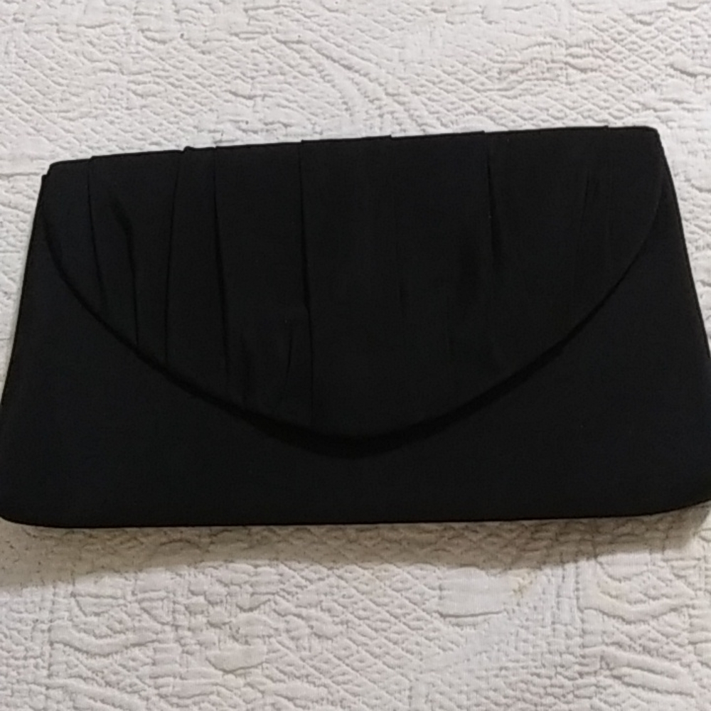 Black satin evening clutch with cord to wear on shoulder or not. In good conditi